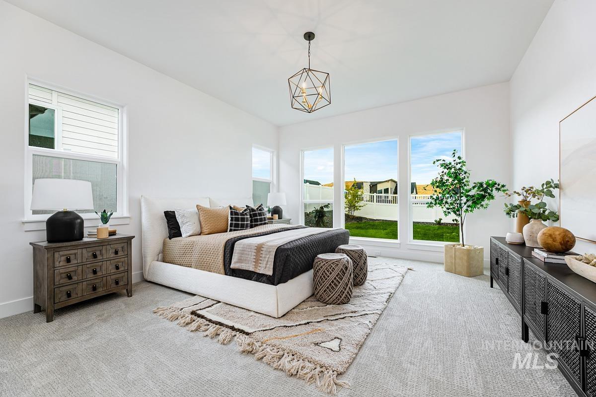 13339 North Hazel Grouse Way Boise, ID 83714 - Photo 17 of 50 Bedroom featuring carpet and suspended lighting