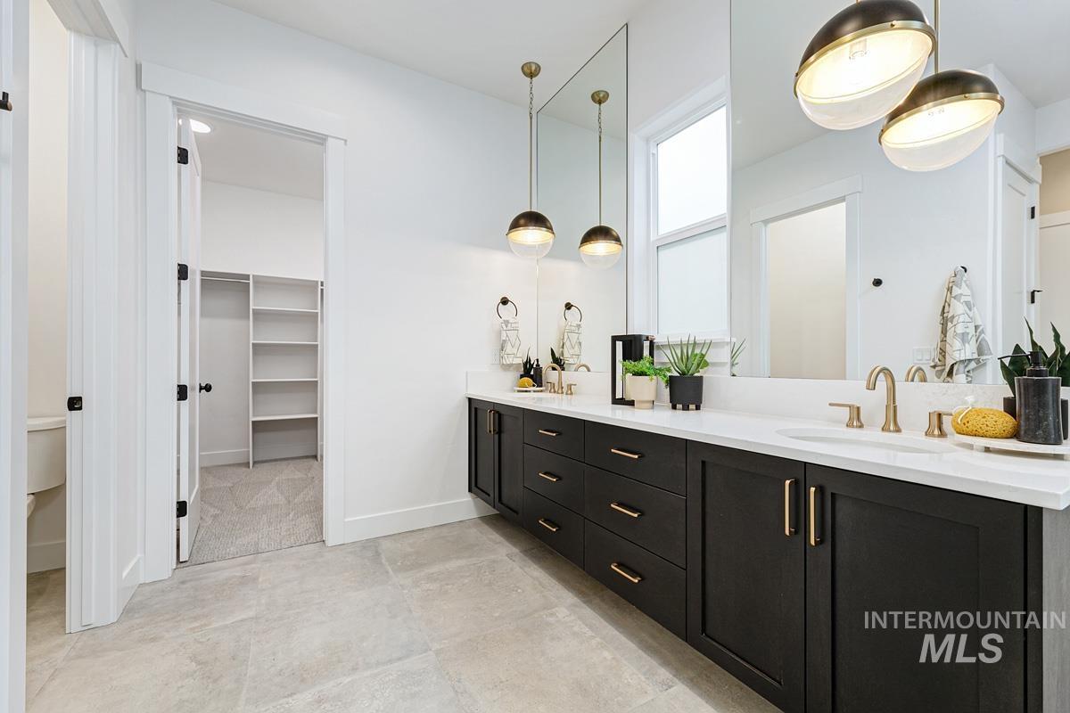 13339 North Hazel Grouse Way Boise, ID 83714 - Photo 20 of 50 Bathroom with double vanity and a spacious closet