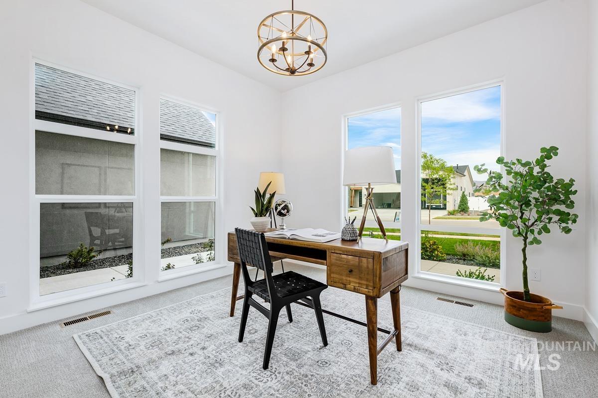 13339 North Hazel Grouse Way Boise, ID 83714 - Photo 23 of 50 Carpeted home office with a chandelier and baseboards