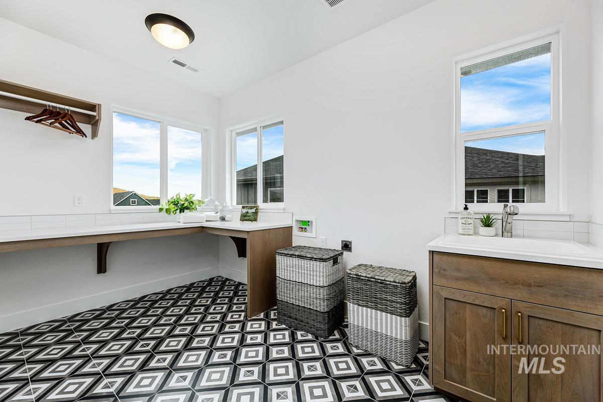 13339 North Hazel Grouse Way Boise, ID 83714 - Photo 37 of 50 Home office featuring baseboards and a sink