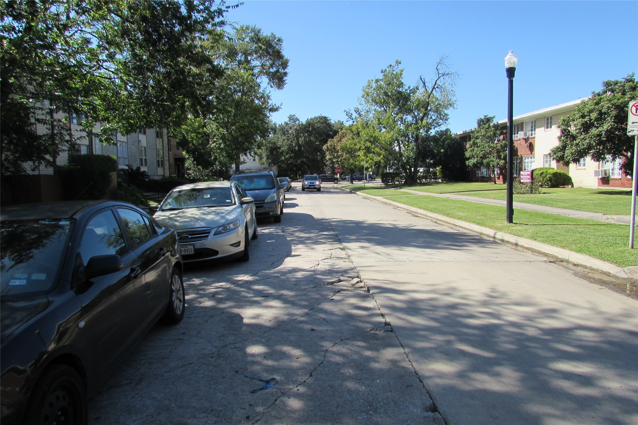 2513 Shakespeare Street, Unit 3 Houston, TX 77030 - Photo 15 of 15 a view of a backyard with couches under an umbrella