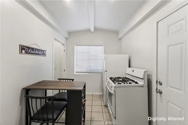 a kitchen with a sink cabinets and a stove top oven