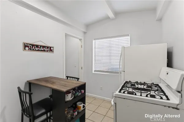 a kitchen with a stove and a refrigerator