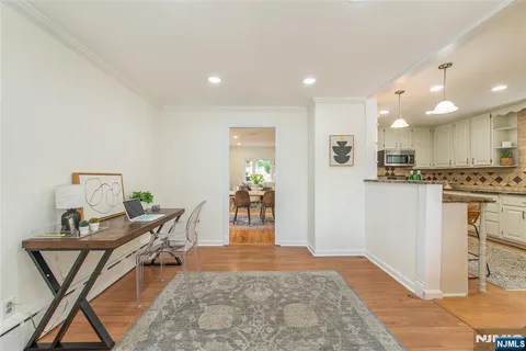 a view of a kitchen and an entryway