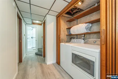 a view of bathroom with a washer and dryer