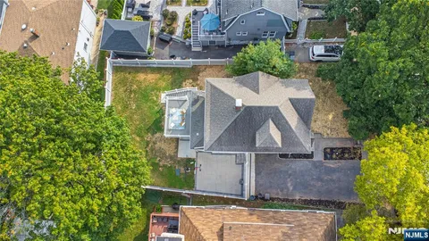 an aerial view of a house with a garden