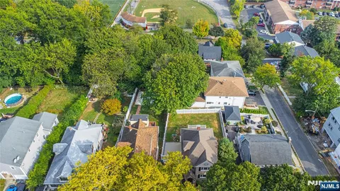 an aerial view of house with yard swimming pool and outdoor seating