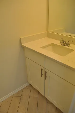 an empty room with wooden floor