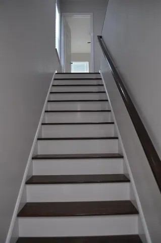 a kitchen with a sink and a refrigerator