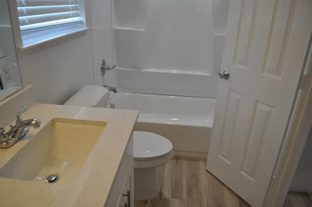 a bathroom with a sink and toilet