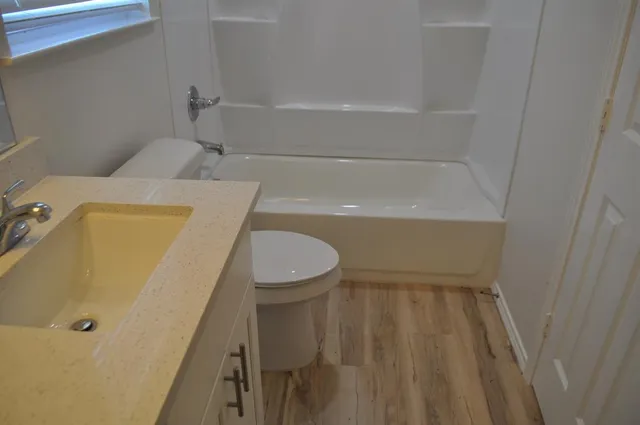 a bathroom with a sink and a bath tub