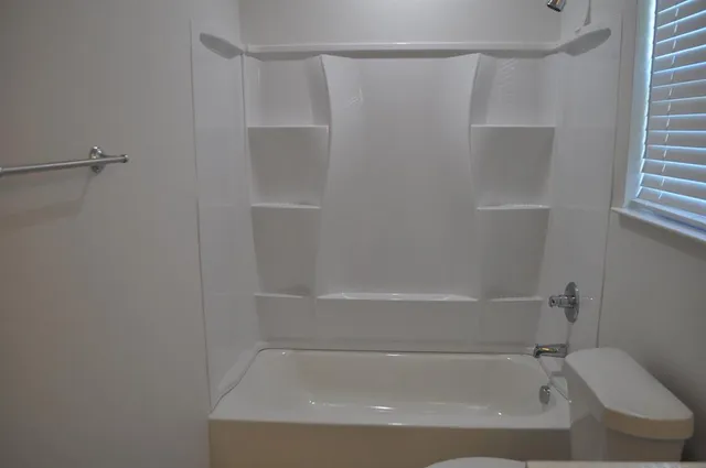 a bathroom with a sink and toilet