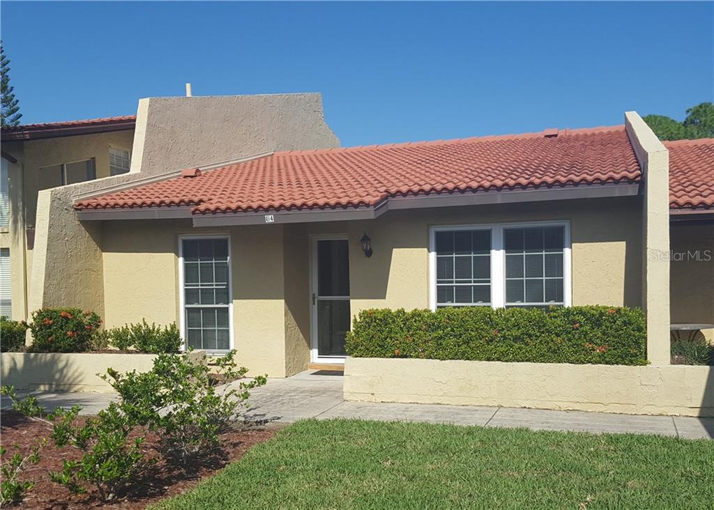 7200 Ulmerton Road, Unit G4 Largo, FL 33771 - Photo 1 of 1 Welcome Home!! Reserved parking space/carport is just to the right of the home.