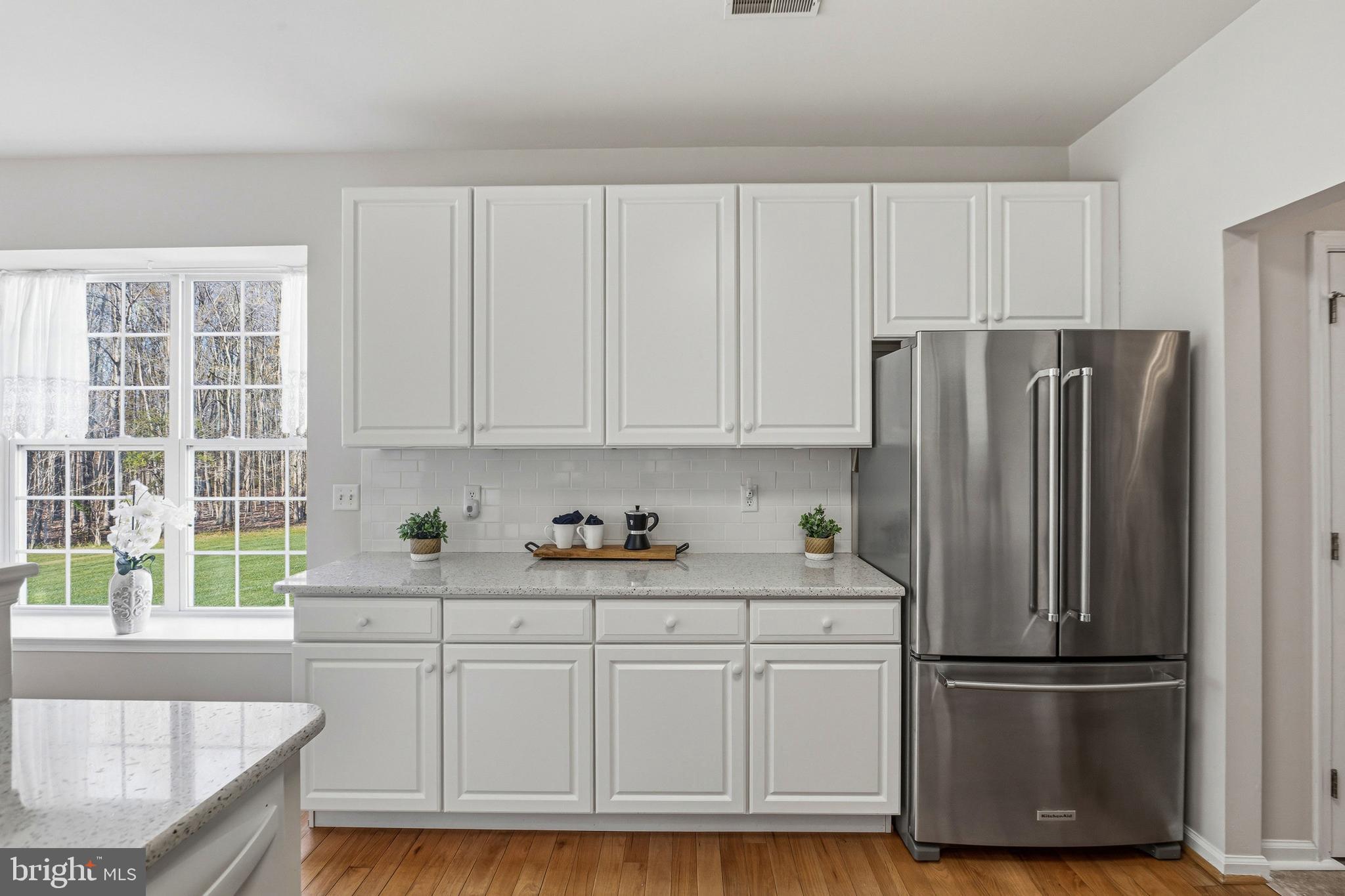 88 Springmill Drive Middletown, DE 19709 - Photo 15 of 63 a kitchen with stainless steel appliances granite countertop a refrigerator sink and cabinets