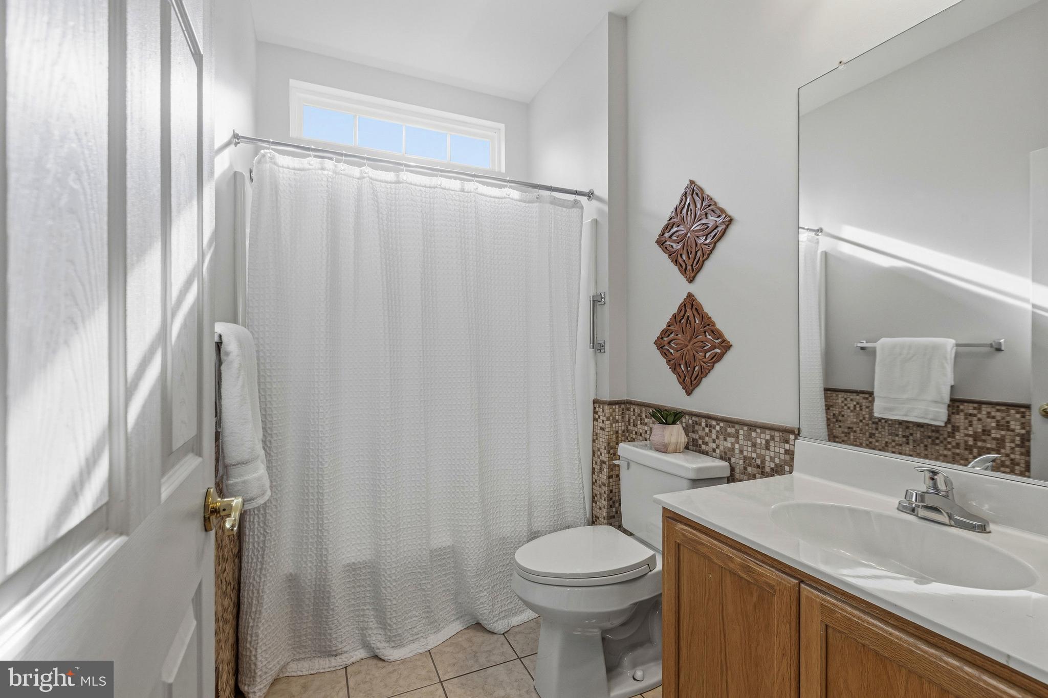 88 Springmill Drive Middletown, DE 19709 - Photo 21 of 63 a bathroom with a sink toilet and shower