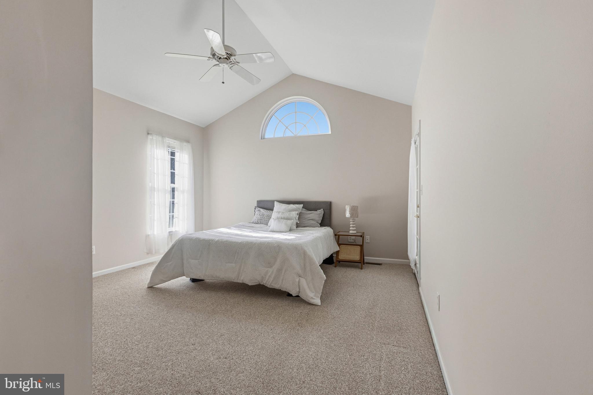 88 Springmill Drive Middletown, DE 19709 - Photo 24 of 63 a spacious bedroom with a bed and a ceiling fan