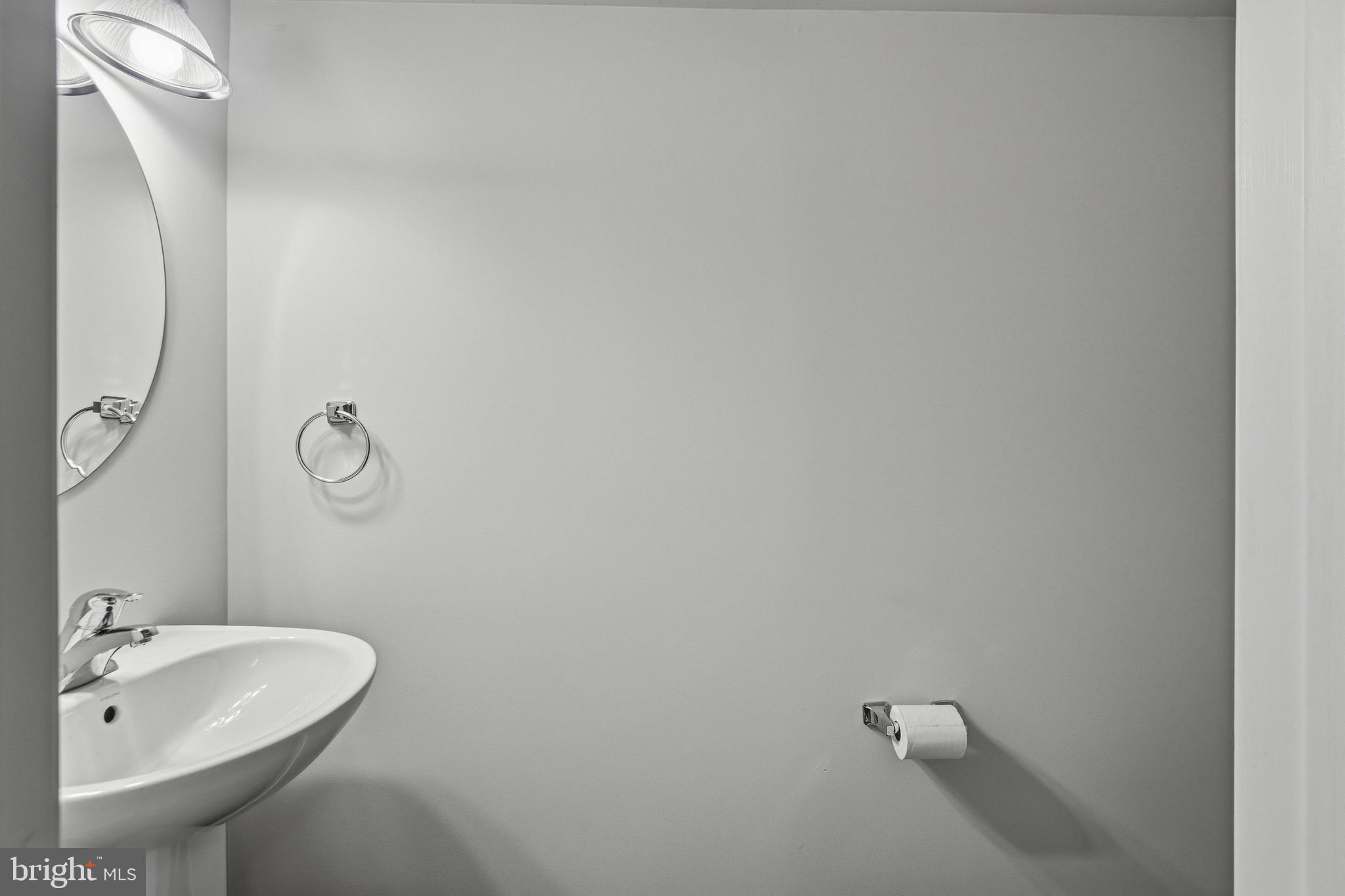 88 Springmill Drive Middletown, DE 19709 - Photo 30 of 63 a bathroom with a sink and mirror