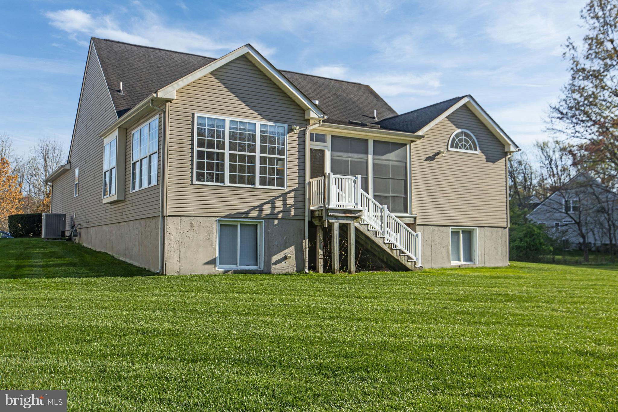 88 Springmill Drive Middletown, DE 19709 - Photo 49 of 63 a front view of house with yard and green space