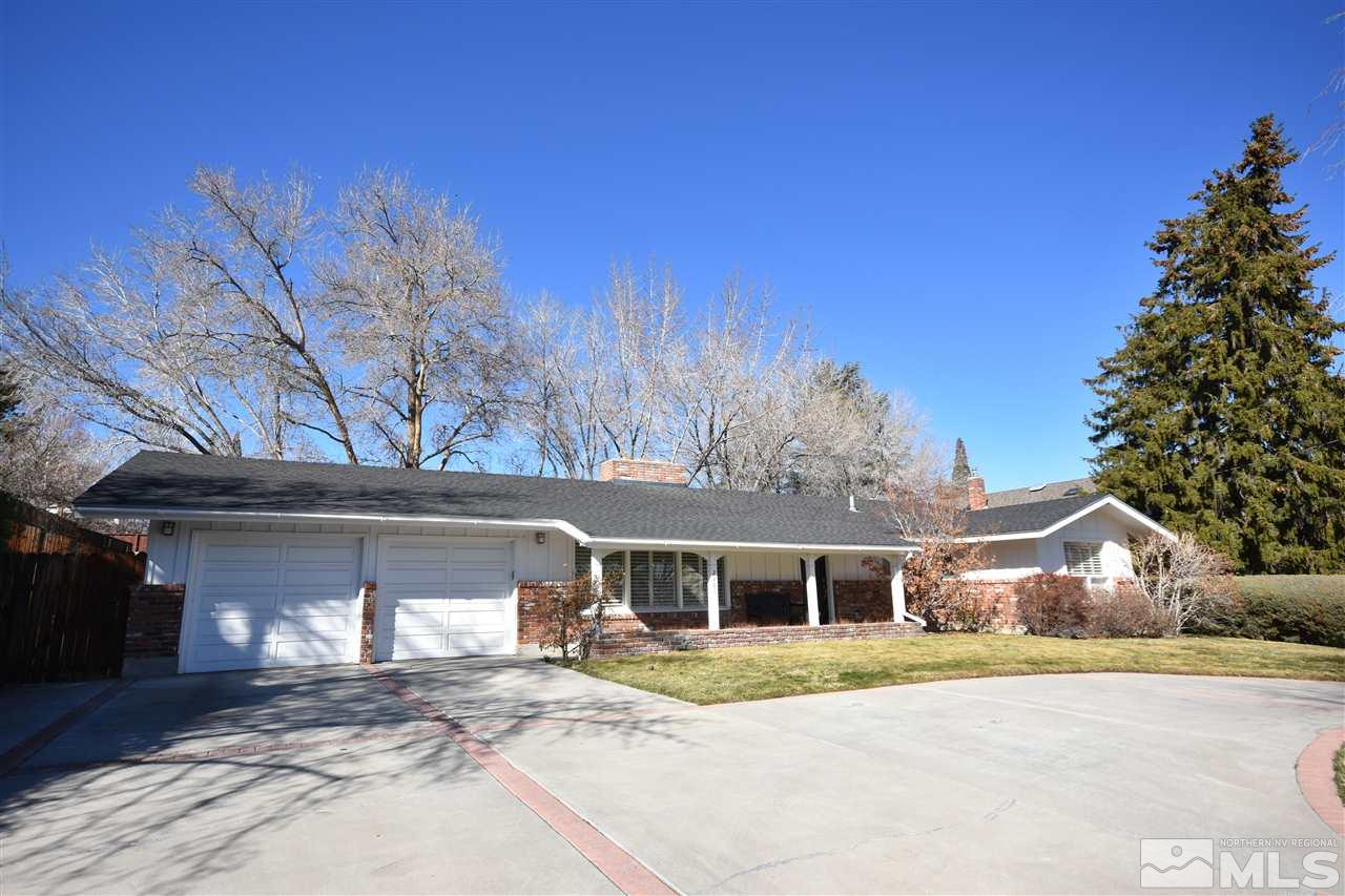2201 Barnes Boulevard Reno, NV 89509 - Photo 1 of 1 a front view of a house with a yard and garage
