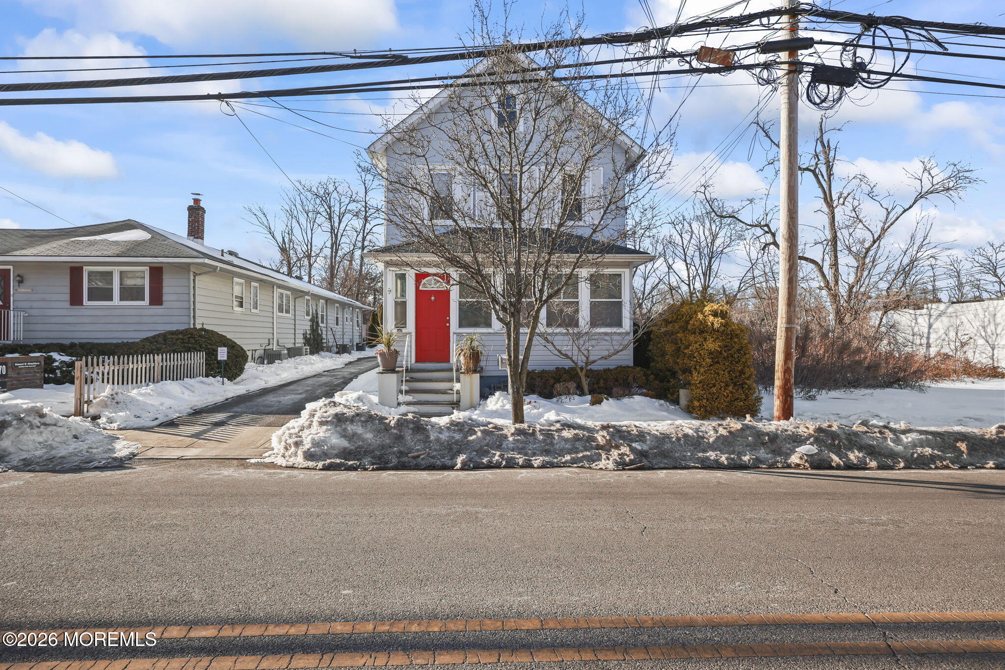 a view of a house with a snow on the road
