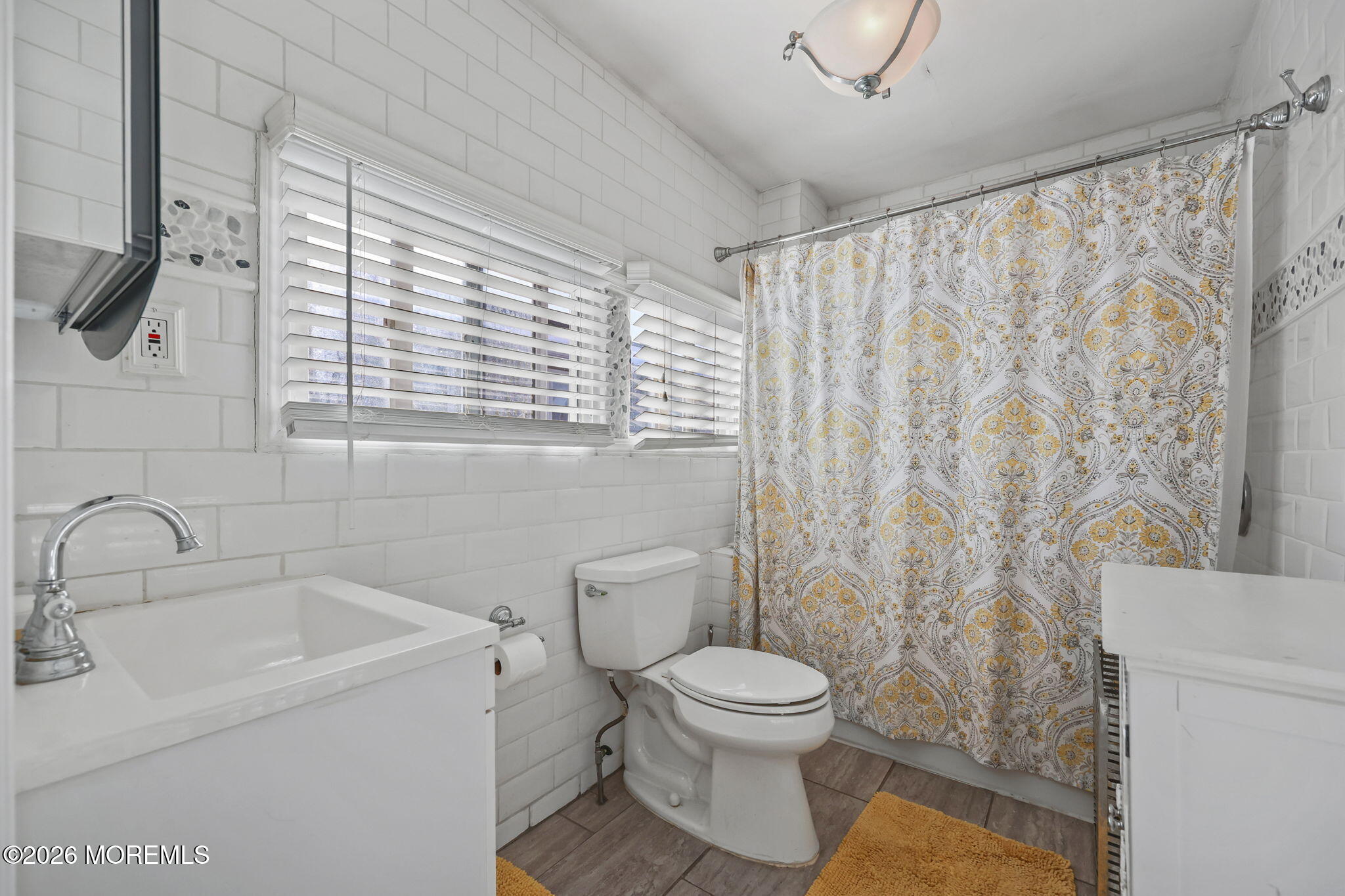 68 Main Street Matawan, NJ 07747 - Photo 14 of 29 a bathroom with a toilet sink and shower