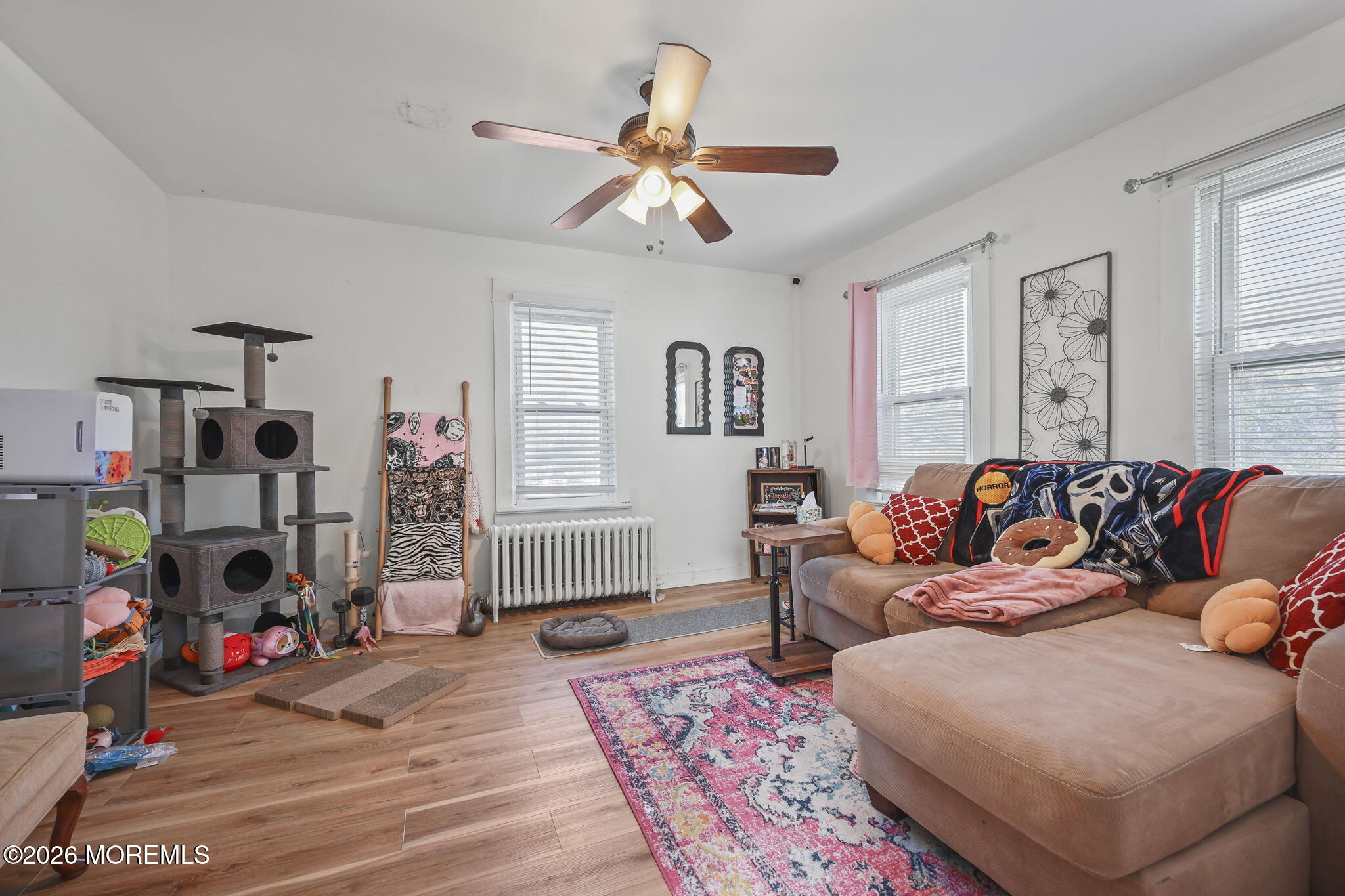 68 Main Street Matawan, NJ 07747 - Photo 20 of 33 a living room with furniture and a window
