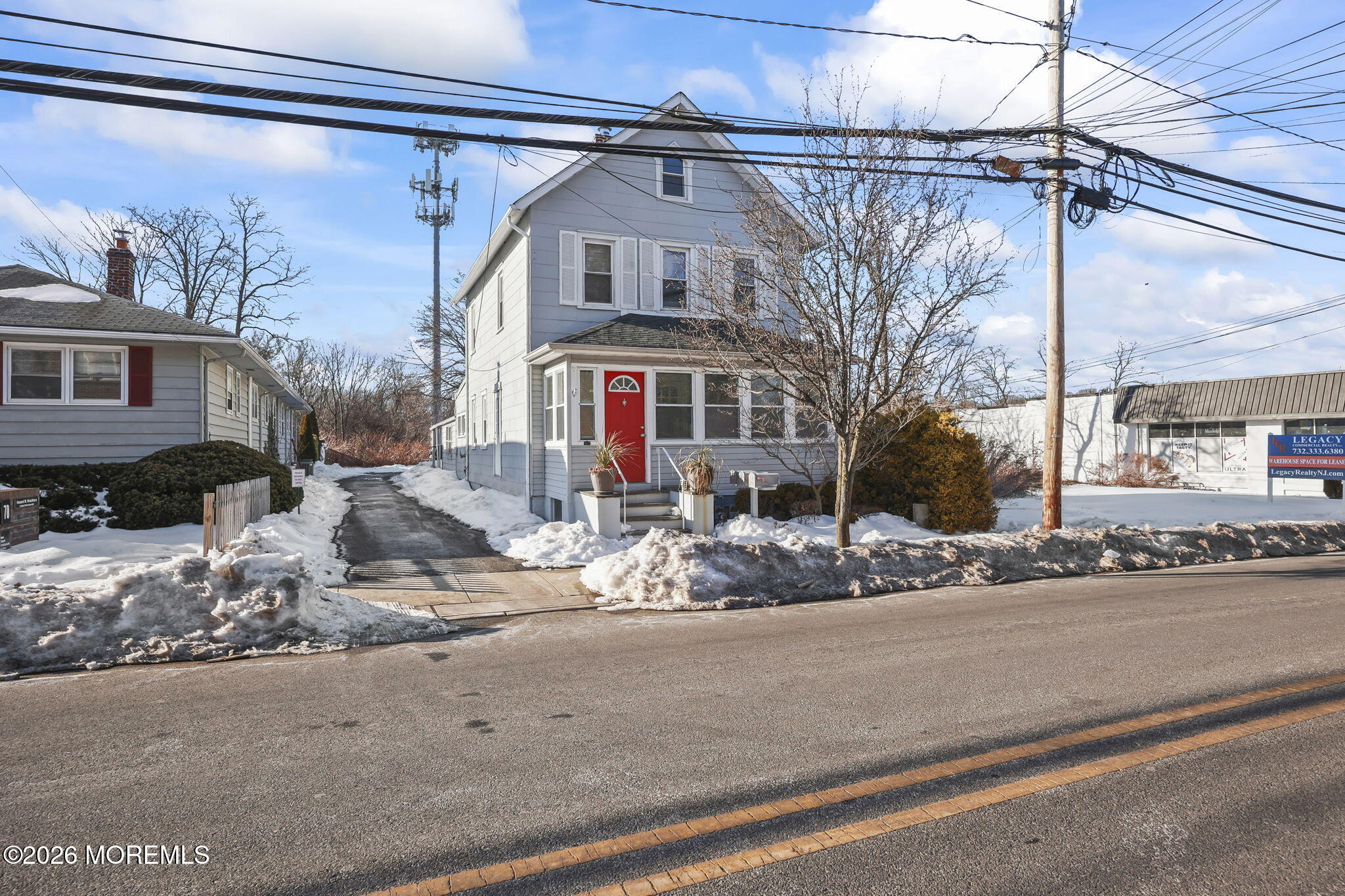 68 Main Street Matawan, NJ 07747 - Photo 2 of 33 a front view of a house with a yard