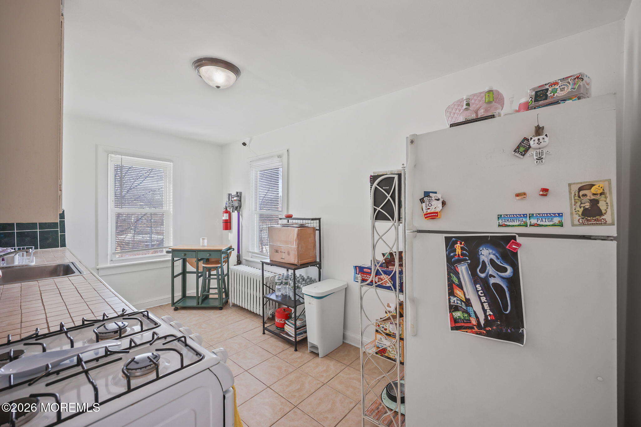 68 Main Street Matawan, NJ 07747 - Photo 24 of 33 a bedroom with furniture and a table