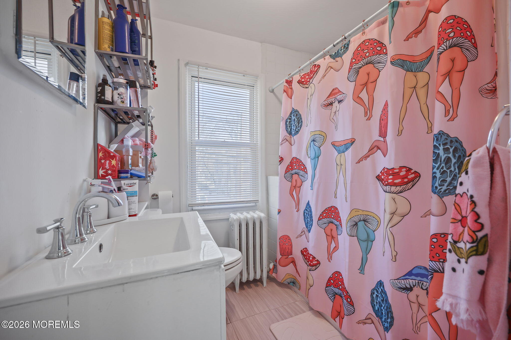 68 Main Street Matawan, NJ 07747 - Photo 25 of 29 a bathroom with a sink and a mirror