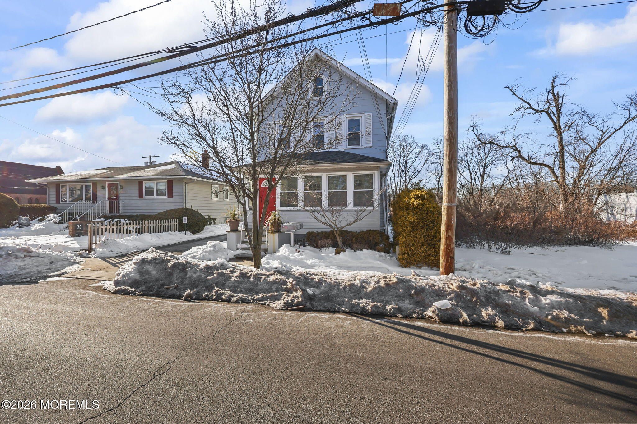 68 Main Street Matawan, NJ 07747 - Photo 3 of 33 a front view of a house with a yard and garage