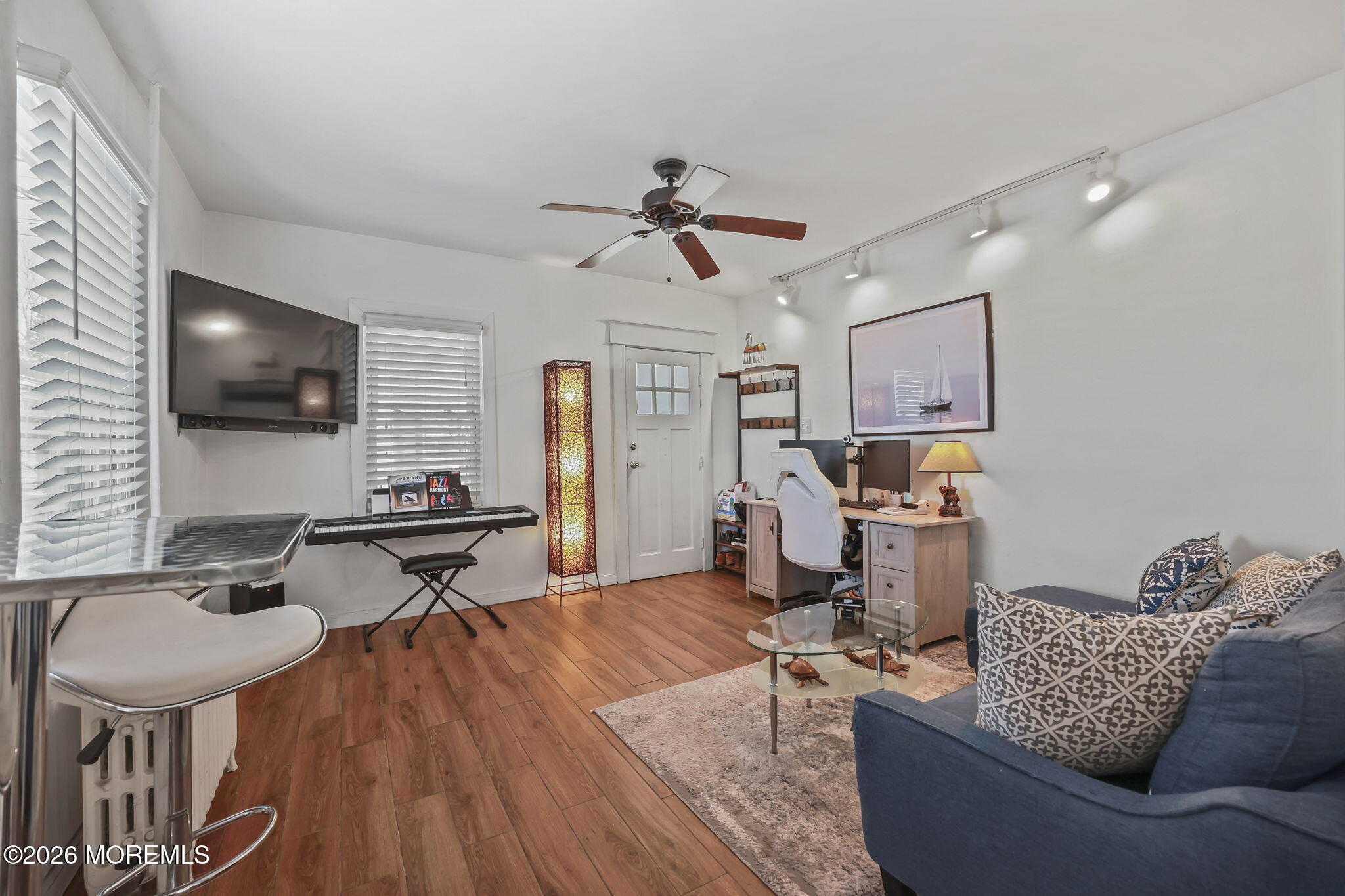 68 Main Street Matawan, NJ 07747 - Photo 4 of 29 a living room with furniture and a flat screen tv