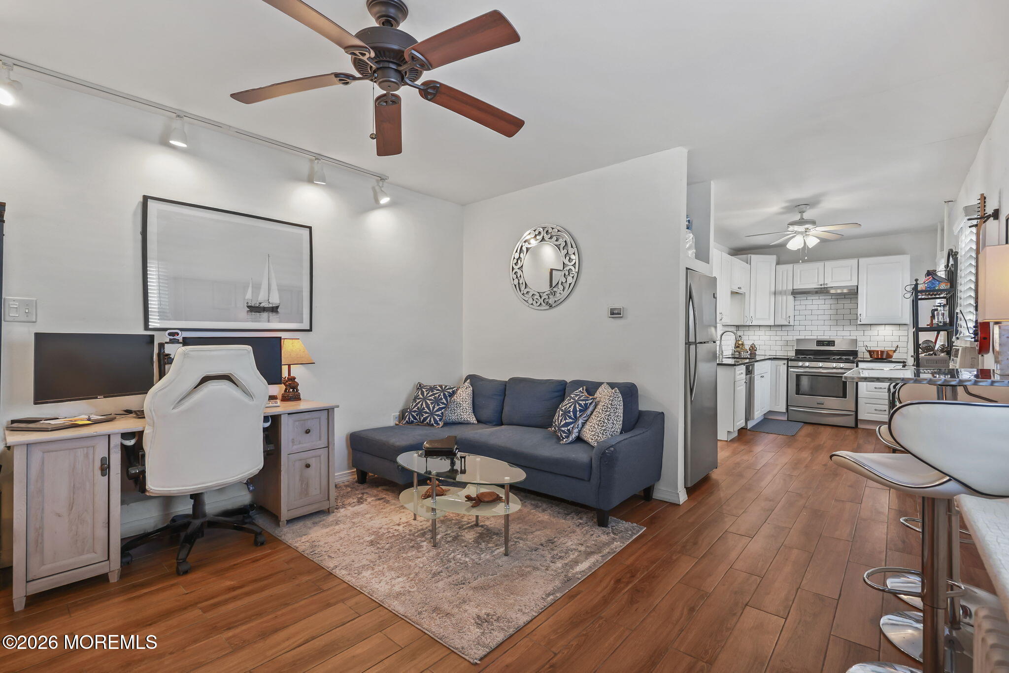 68 Main Street Matawan, NJ 07747 - Photo 5 of 29 a living room with furniture and kitchen view