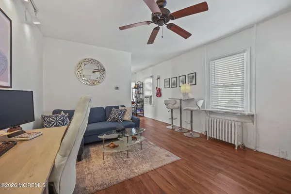 a kitchen with stainless steel appliances a sink dishwasher a refrigerator and wooden cabinets