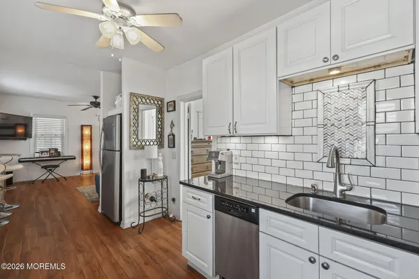 a bedroom with a bed couch and a window