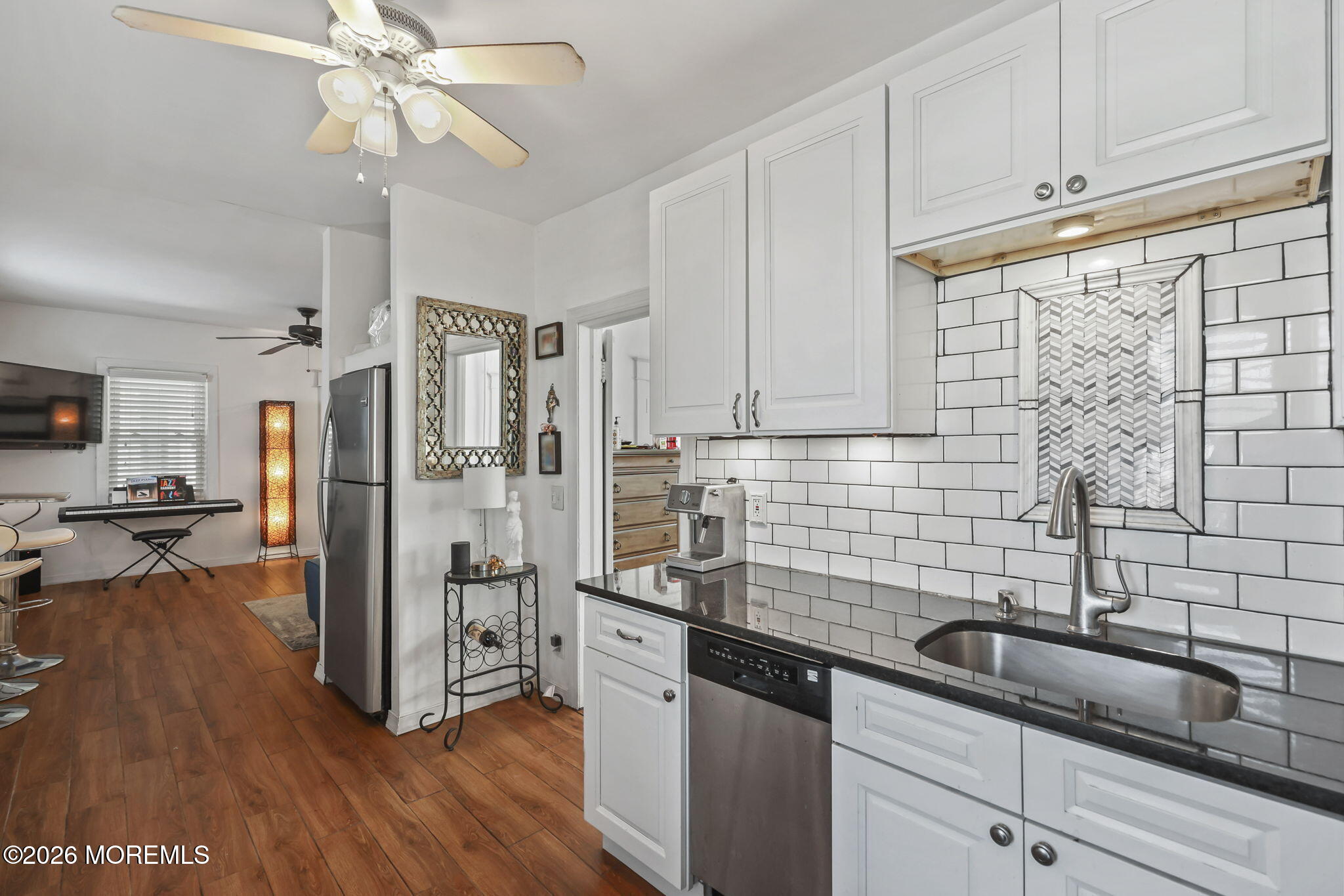 68 Main Street Matawan, NJ 07747 - Photo 9 of 29 a kitchen with stainless steel appliances a sink dishwasher a refrigerator and wooden cabinets