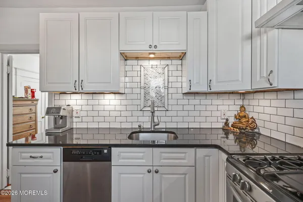a bathroom with a toilet sink and shower