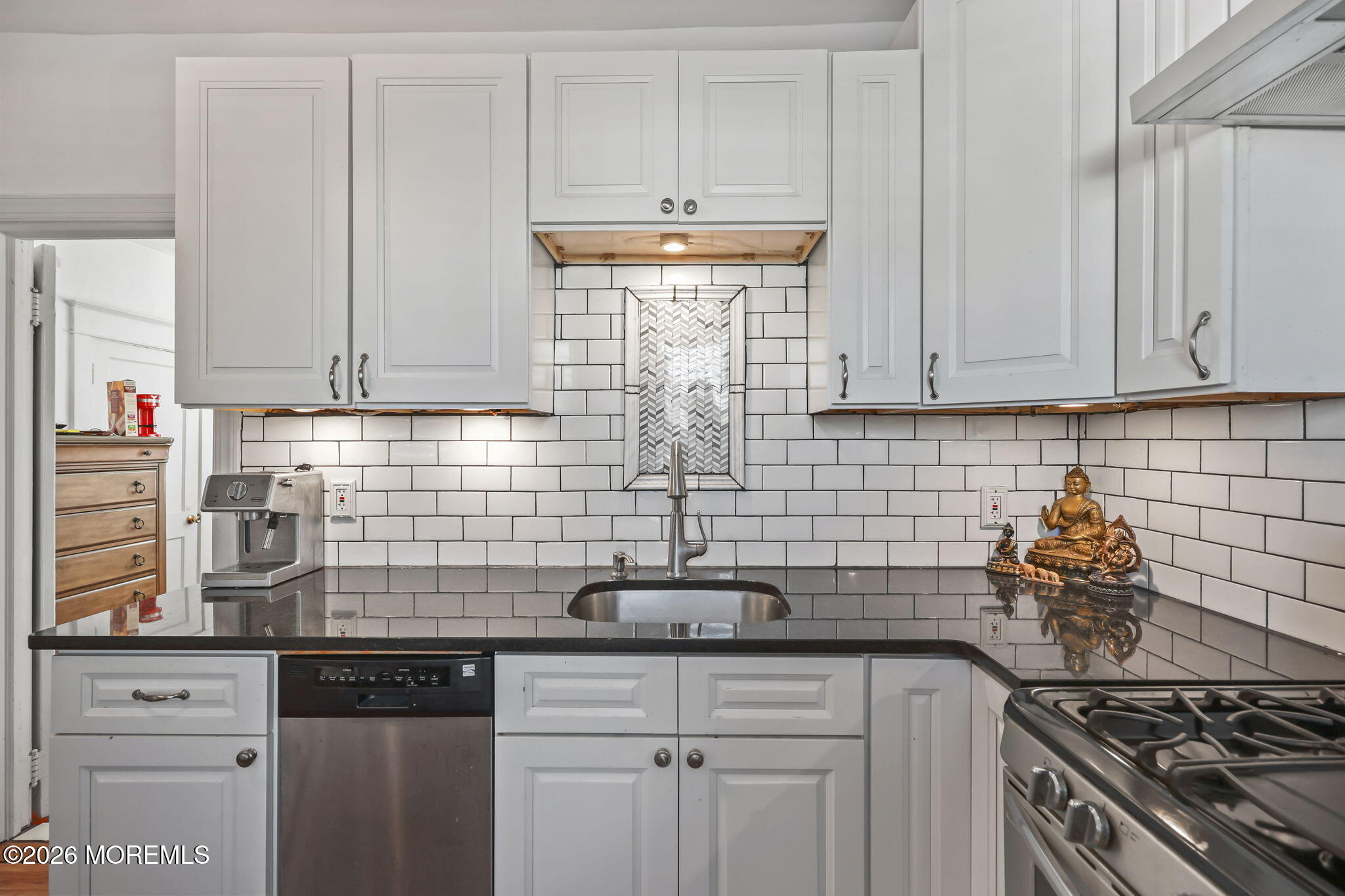 68 Main Street Matawan, NJ 07747 - Photo 10 of 29 a kitchen with white cabinets and appliances