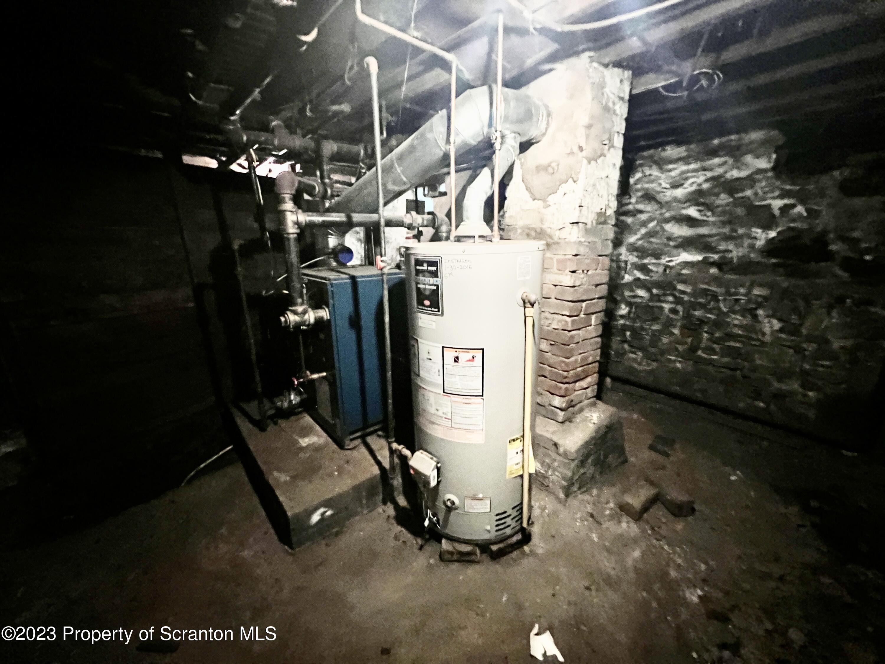 959 Constitution Avenue Jessup, PA 18434 - Photo 19 of 27 a room with water heater and a shower