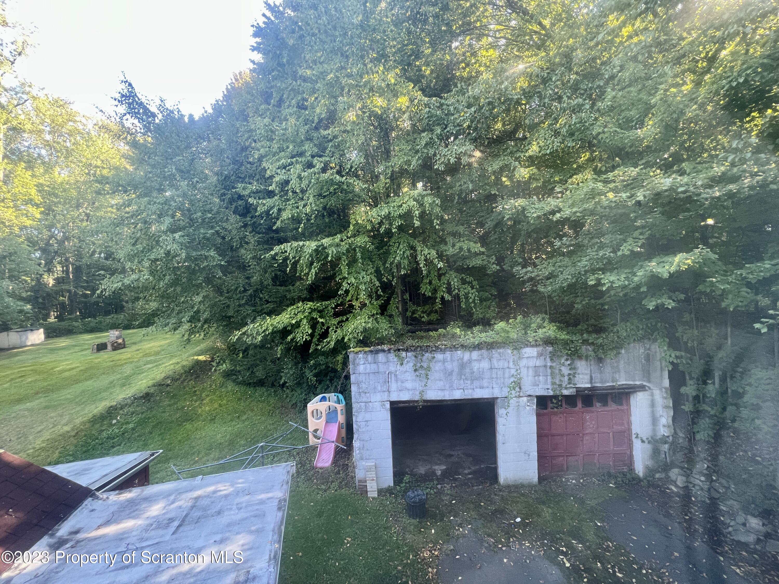 959 Constitution Avenue Jessup, PA 18434 - Photo 24 of 27 a view of a wooden deck and a tree