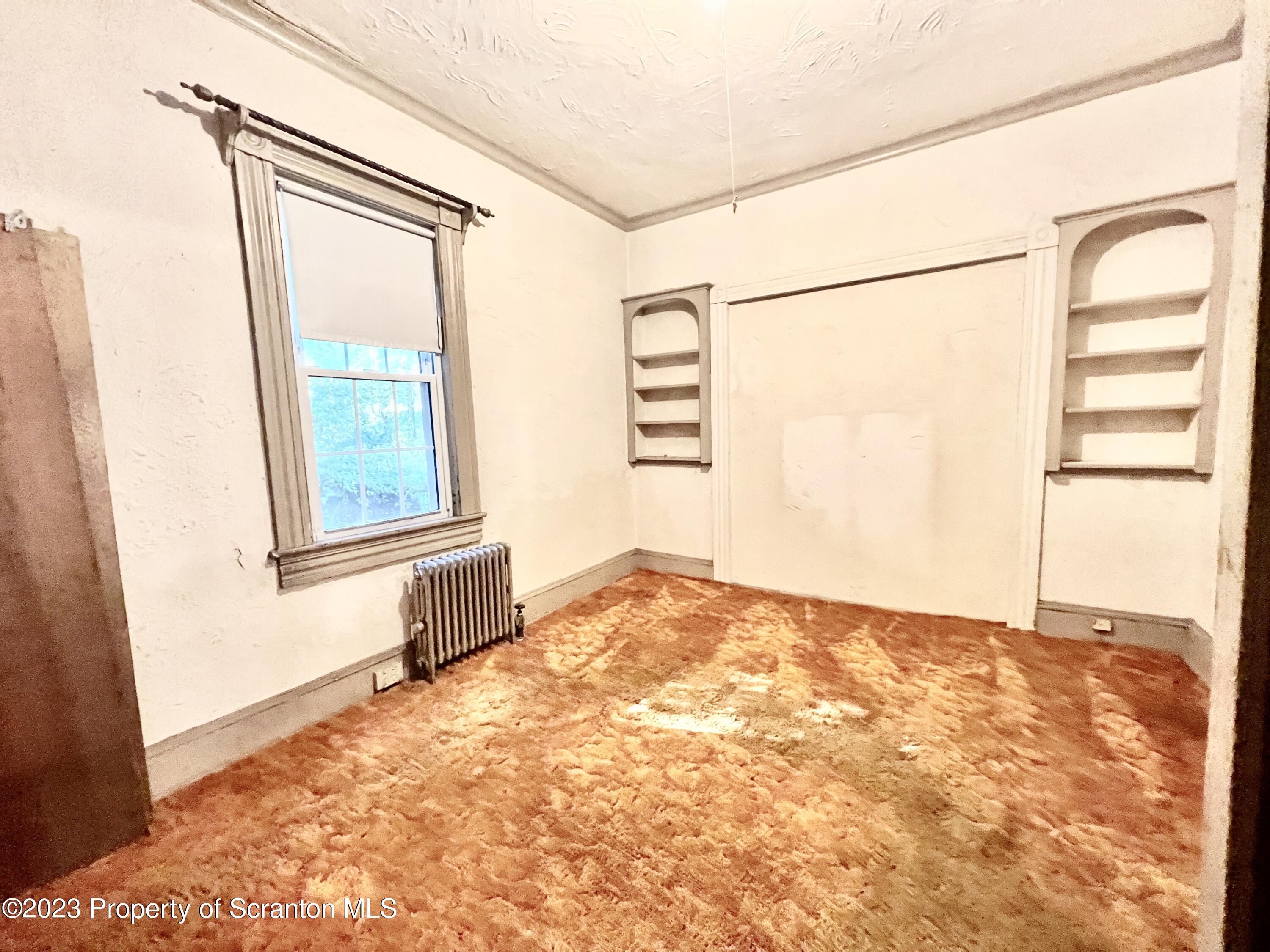 959 Constitution Avenue Jessup, PA 18434 - Photo 10 of 27 a view of an empty room with a window