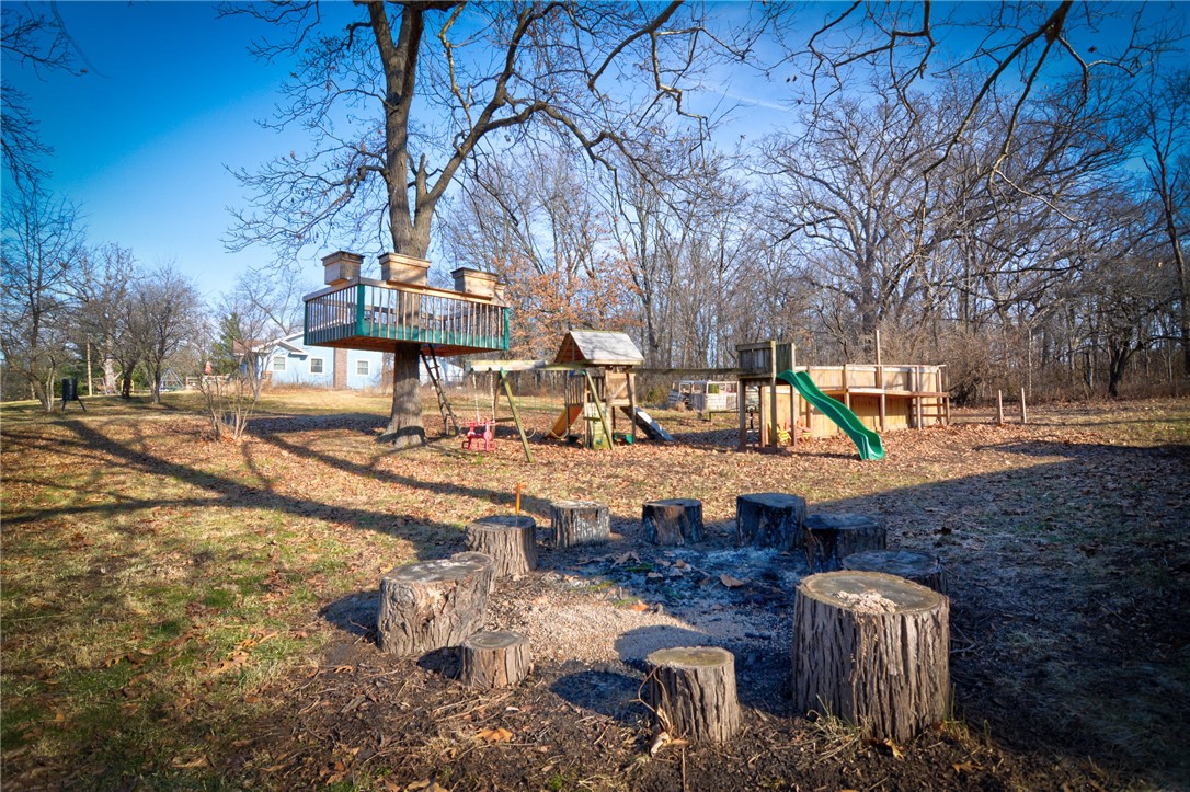 2552 Crossroads Road Decatur, IL 62521 - Photo 34 of 42 North side view w firepit, suspended treehouse