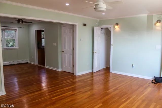 a view of a bathroom from a corridor