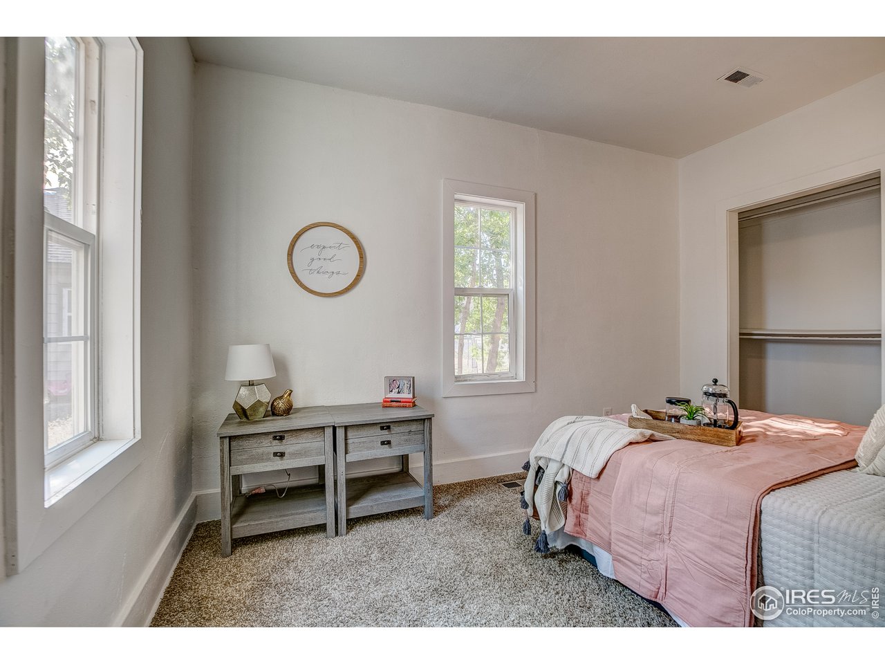 26 Main Street Windsor, CO 80550 - Photo 13 of 22 a bedroom with a bed and a window