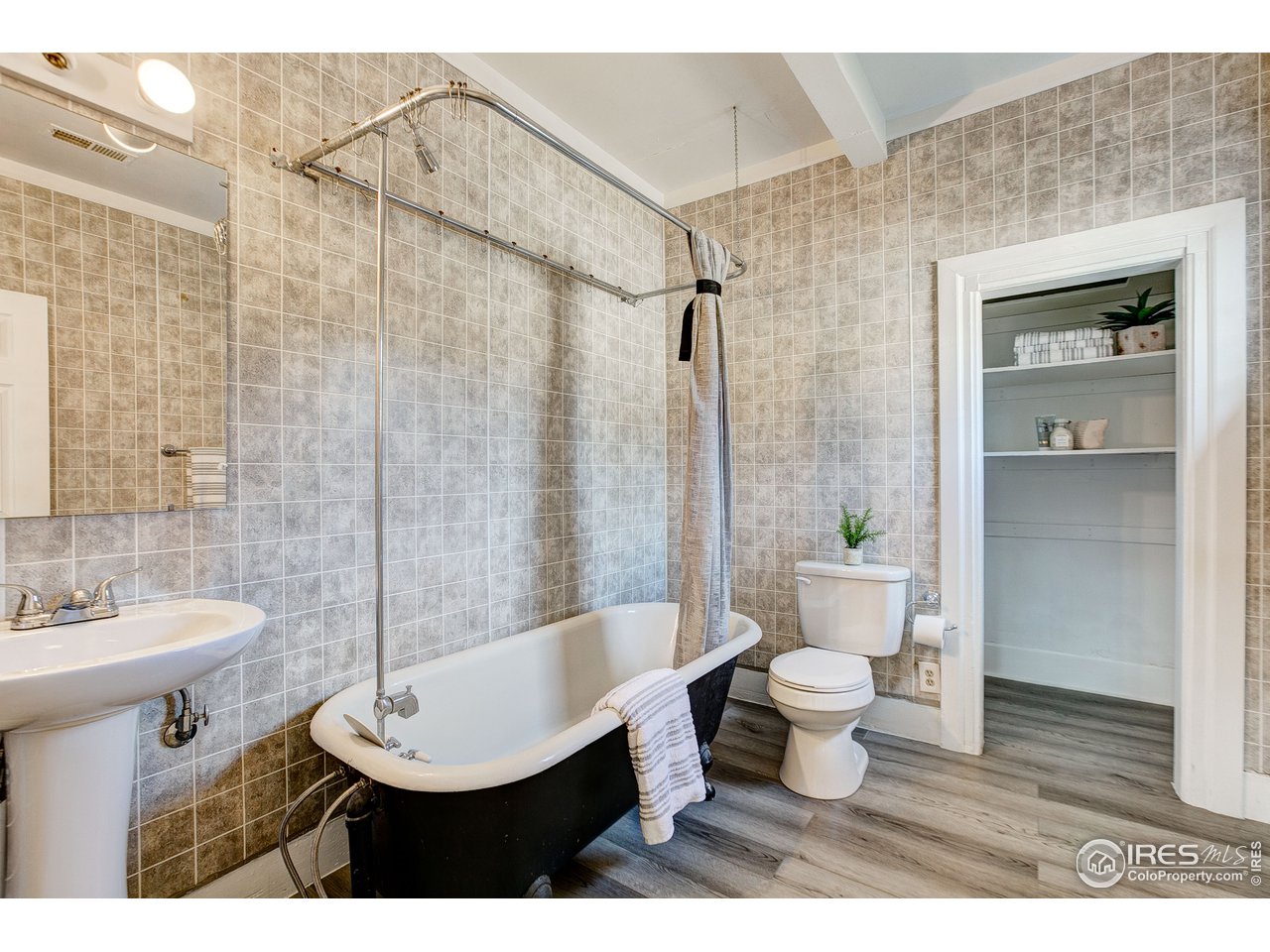 26 Main Street Windsor, CO 80550 - Photo 14 of 22 a bathroom with a sink toilet and shower