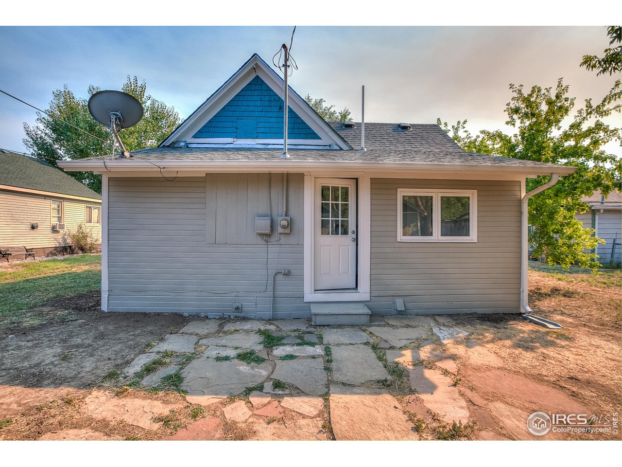 26 Main Street Windsor, CO 80550 - Photo 18 of 22 a view of a house with a yard