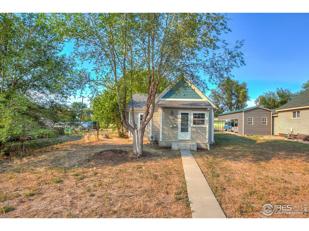 26 Main Street Windsor, CO 80550 - Photo 2 of 22 a house view with a outdoor space