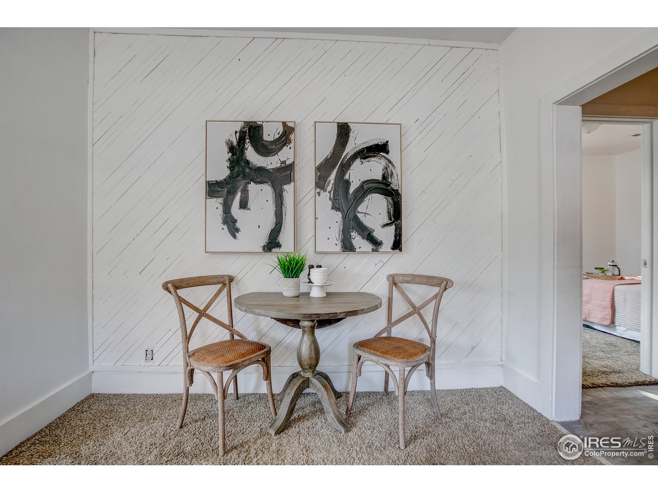 26 Main Street Windsor, CO 80550 - Photo 10 of 22 a dining room with furniture and painting on the wall