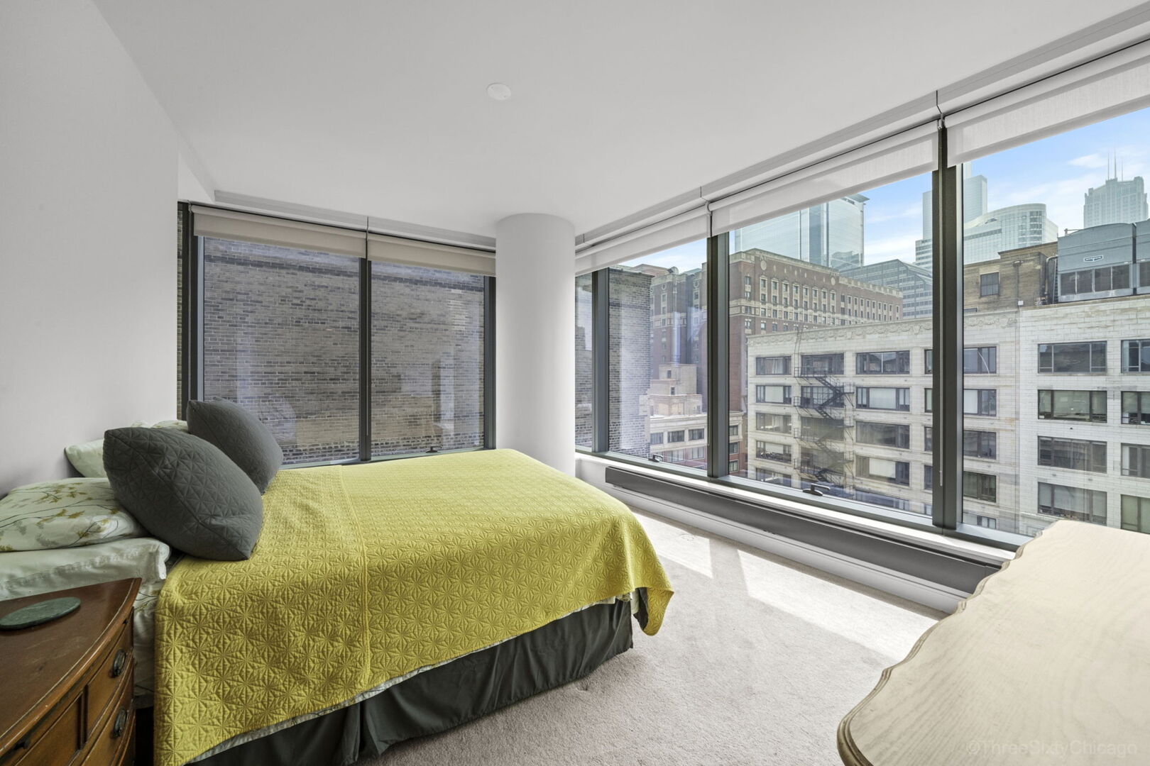 60 East Monroe Street, Unit 1604 Chicago, IL 60603 - Photo 14 of 34 a bedroom with a bed and a large window with outer view