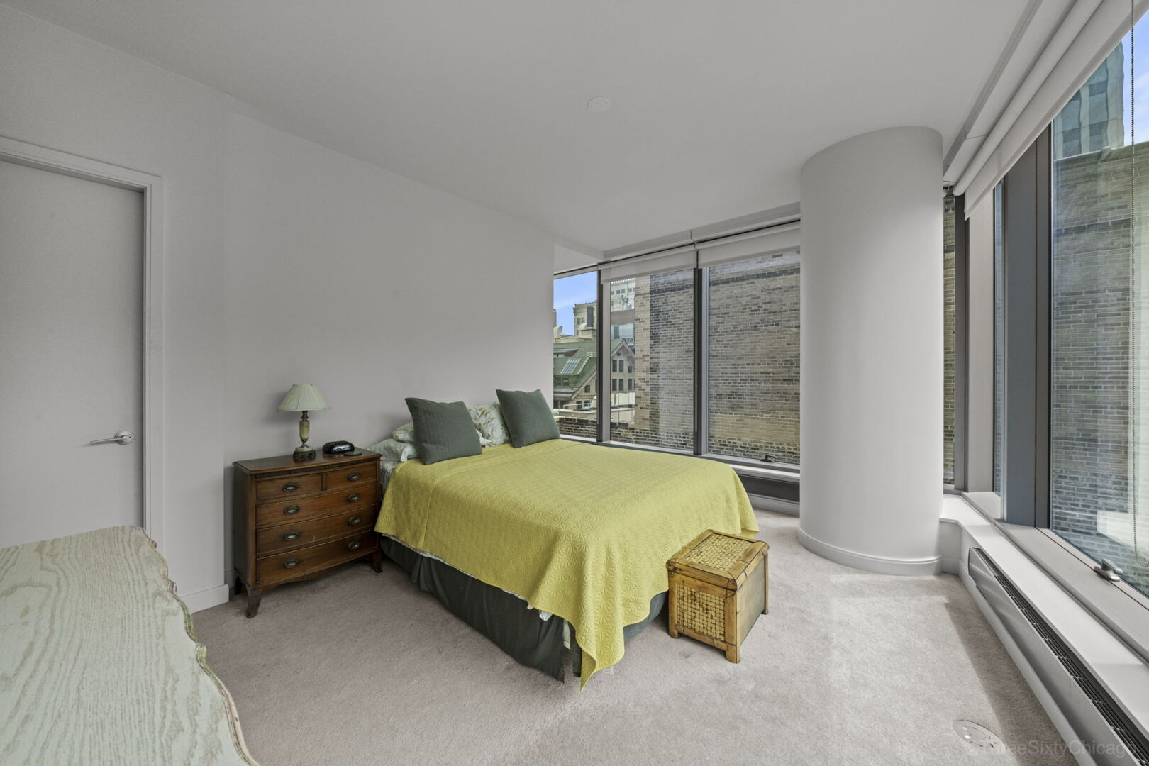 60 East Monroe Street, Unit 1604 Chicago, IL 60603 - Photo 15 of 34 a bedroom with a bed and window