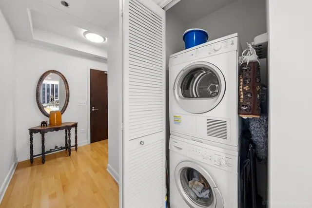 a view of a livingroom with furniture and mirror